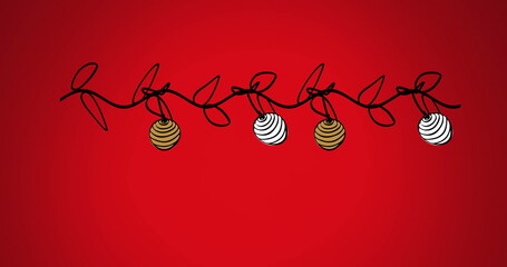 Image of bauble swinging on leaves against red background