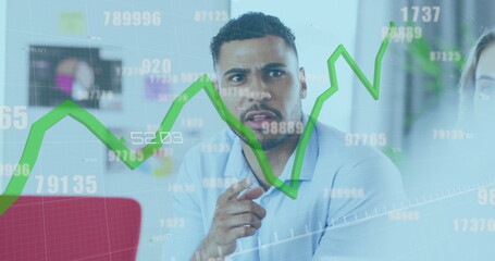 Image of green line and data processing over biracial businessman in office