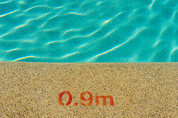 Entrance to the pool with a depth indication of 0.9 meters.