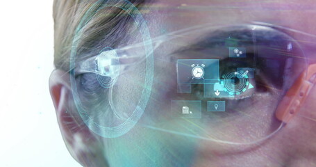 Image of media icons over eye of woman in vr glasses using interface