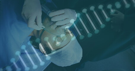 Image of dna strand spinning over caucasian male patient with oxygen mask