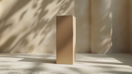 Cardboard box on a textured surface with shadows.