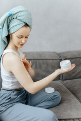 Body Care. Woman Applying Moisturizing Lotion Or Cream On Shoulders Caring For Skin At Home