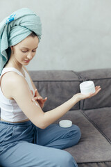 Body Care. Woman Applying Moisturizing Lotion Or Cream On Shoulders Caring For Skin At Home