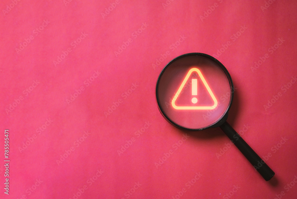 Poster glowing red triangle caution warning or exclamation sign inside magnifier glass for notification err