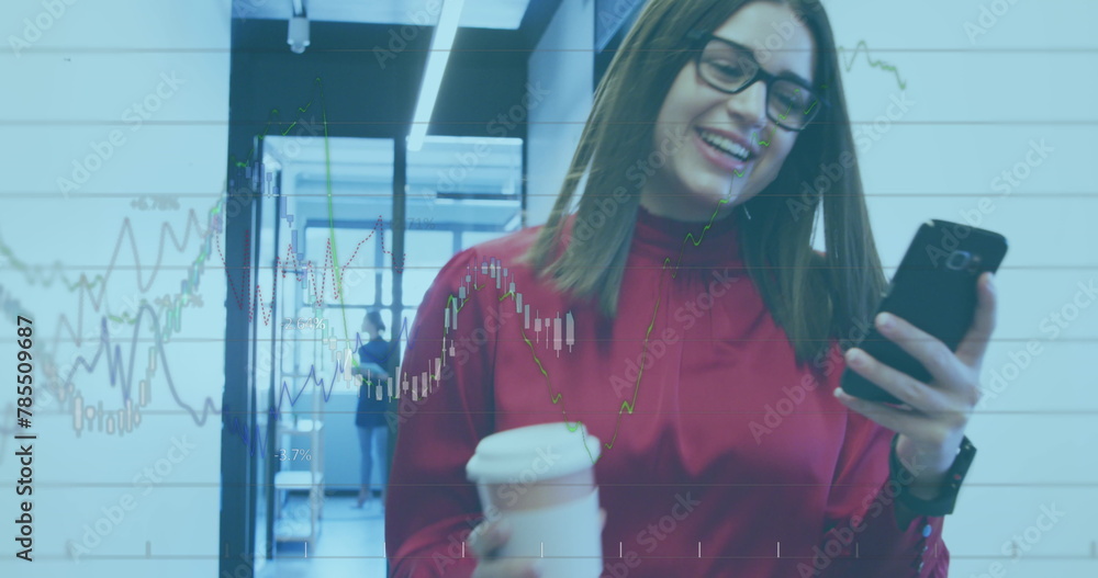 Poster Image of financial data over caucasian businesswoman with coffee and smartphone in office