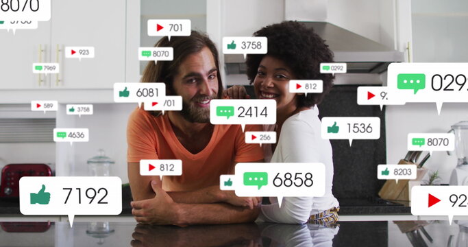 Image of media icons over diverse couple