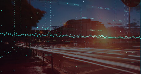 Image of graph and data processing over road and cityscape at night