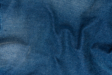 Blue jeans denim texture as a background. Top view.