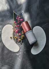 a jar of glue and a set of lashmaker tools