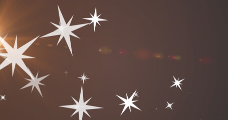 Obraz premium Image of stars and light on brown background