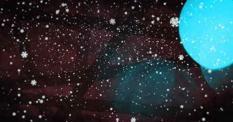 Digital image of blue lens flare and snowflakes falling against lines