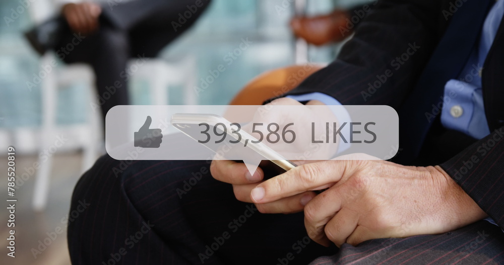 Poster image of media icon over hands using smartphone