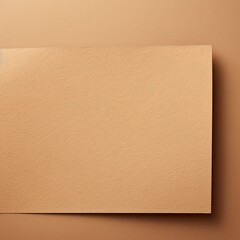 Tan background with dark tan paper on the right side, minimalistic background, copy space concept, top view