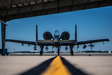 A fighter jet is parked on the runway