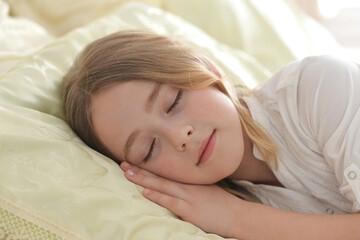 Fototapeta na wymiar Adorable cute little girl sleeping in bed