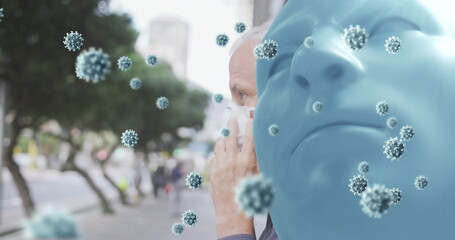 Image of covid 19 cells over blue face and caucasian man wearing face mask