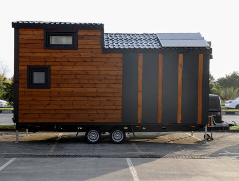 Mobile tiny house, great for outdoor experiences and holidays.  mobility and pure adventure. construction of a mini house. relocated on city. House on wheels. motor home. caravan. solar panels on roof