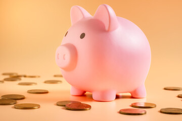 Pink piggy bank overflowing with coins, a popular way to save money