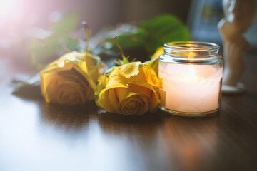 Candle and flowers. romantic cozy atmosphere
