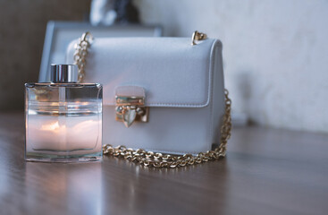 Women's accessories. Perfume and handbag