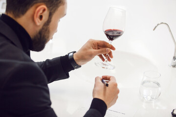 Wine degustation. Sommelier Perfecting Wine Tasting Skills in Professional Development Courses, Close up  - 785531690