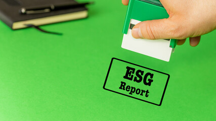 ESG report, Environmental social governance, President putting a stamp authorizing the company's ESG report, Green background copy space - 785534800