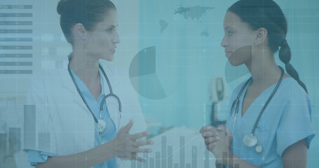 Image of data processing over diverse female doctor and health worker discussing at hospital