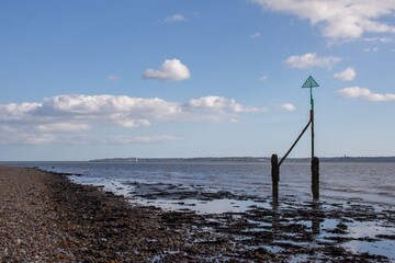 seaside sentry on a deserted beach at Browndown Hampshire England with the Isle of Wight in the...