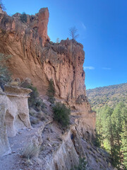 Bandelier National Monument preserves Ancestral Puebloans home in New Mexico. View of Frijoles Canyon from Alcove House. Trail to Alcove House over Frijoles creek.