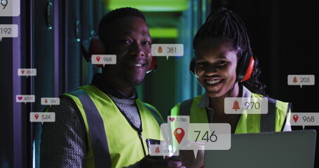 Image of notification bars over african american standing with laptop in server room