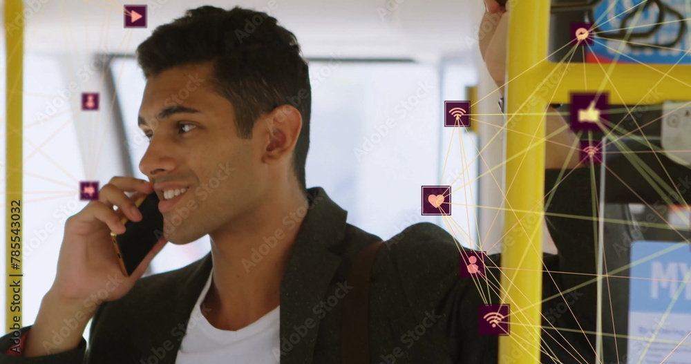 Poster image of connected icons globes over biracial man standing in bus and talking on smartphone
