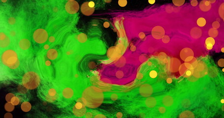Image of orange light orbs over green and pink blots