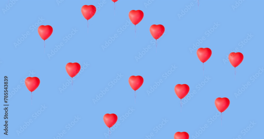 Poster digital image of multiple red heart shaped balloons floating against blue background