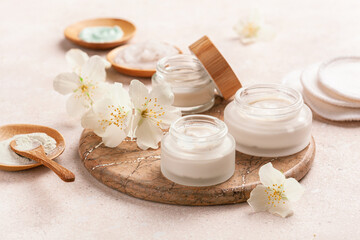 Fototapeta na wymiar skincare products and jasmine flowers. zero waste eco friendly natural cosmetics for home spa