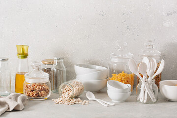 eco friendly kitchen storage. glass jars of grains , pasta and nuts, transparent containers for...