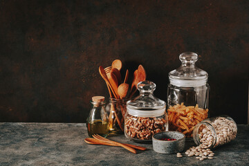 eco friendly kitchen storage. glass jars of grains , pasta and nuts, transparent containers for...