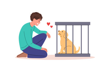 Man wants to adopt dog from shelter and become guardian for pet, standing near smiling puppy in cage. Guy looks at cute dog, feeling love for animal in need of protection and new owner.
