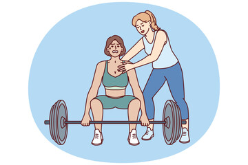 Strong athlete lifts heavy barbell under supervision of personal trainer from gym teaching ward before competition. Bodybuilding trainer supports sportswoman doing pulling exercise in fitness club - 785552492