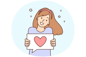 Obraz premium Smiling girl show heart on paper