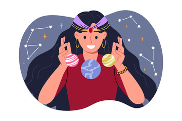 Woman fortune teller is interested in astrology, predicting future by studying constellations in sky and positions planets. Girl studies astrology and numerology, compiling horoscopes or natal chart.