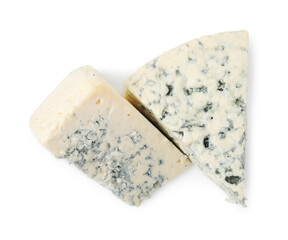 Pieces of delicious blue cheese isolated on white, top view