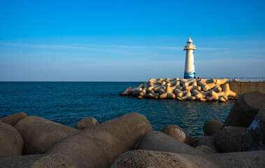 White lighthouse on the coast in Busan, South Korea