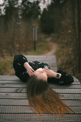 girl lying on the road for bicycles