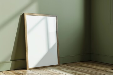 Sunlit room corner with a blank vertical wooden frame leaning against the wall. Mockup frame, Ratio 2x3.