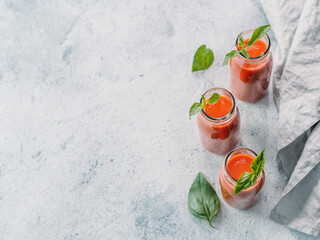 Gaspacho soup in glass bottles, copy space