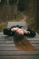girl lying on the road for bicycles