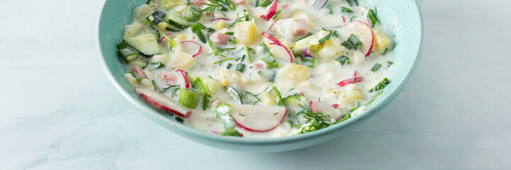 Cold summer soup Okroshka banner, soup with vegetables and sausage, eggs and fresh herbs and yogurt, traditional Russian soup - obrazy, fototapety, plakaty