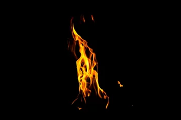 Fotobehang Fire flame texture. Burning material backdrop. Burn effect pattern. Blaze and torch wallpaper. Heat and haze backdrop. © Gyongyi