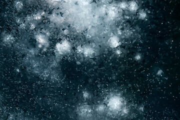 Texture of beautiful blue ice with cracks and air bubbles in the frozen Lake Baikal